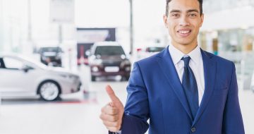 portrait-salesman-car-dealership